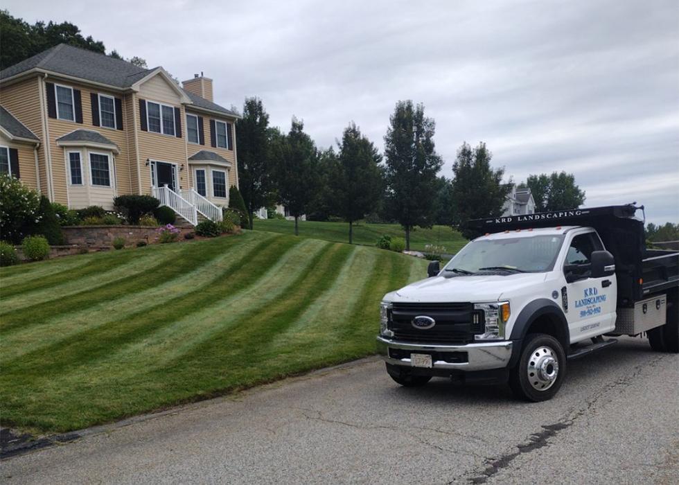 Professional lawn maintenance and care service creating healthy, manicured residential landscape in Worcester County.